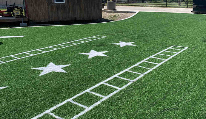 Agility training turf Artificial turf with markings for fitness and agility drills.