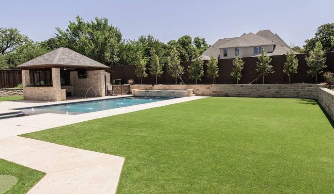 Installed artificial turf in residential backyard pool area Installed artificial turf in residential backyard pool area