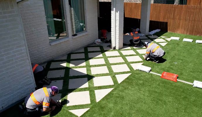 Professionals Installing Artificial Grass