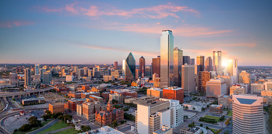 city of Dallas during sunset. - Dallas Artificial Grass Experts