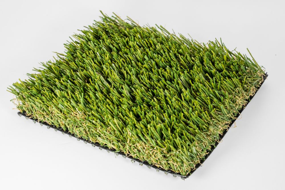Grass mat on white background. Artificial turf tile.