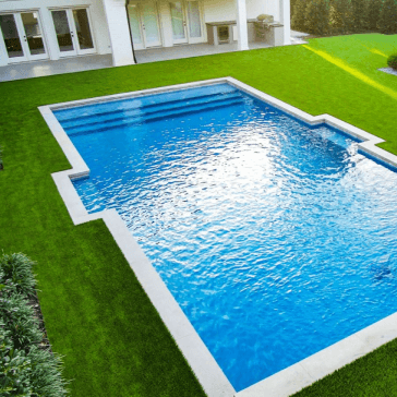 pool with a safe artificial grass outside.