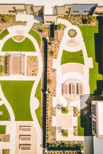 top view shot of a mansion that use artificial grass.