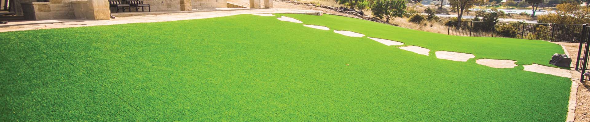 lawn and landscape that use artificial grass. lawn and landscape in your backyard surrounded by artificial grass.