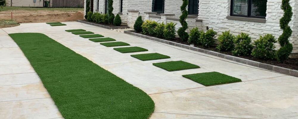 Turf Installation - a sidewalk with grass on it